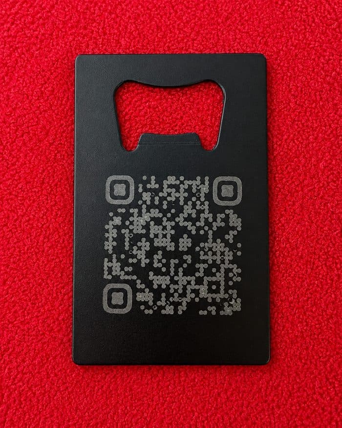 Back of the steel opener: an engraved QR code that scans to the Scoobs Hideout shop