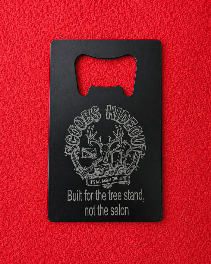 Front of the steel opener: the Scoobs Hideout badge and motto engraved in black